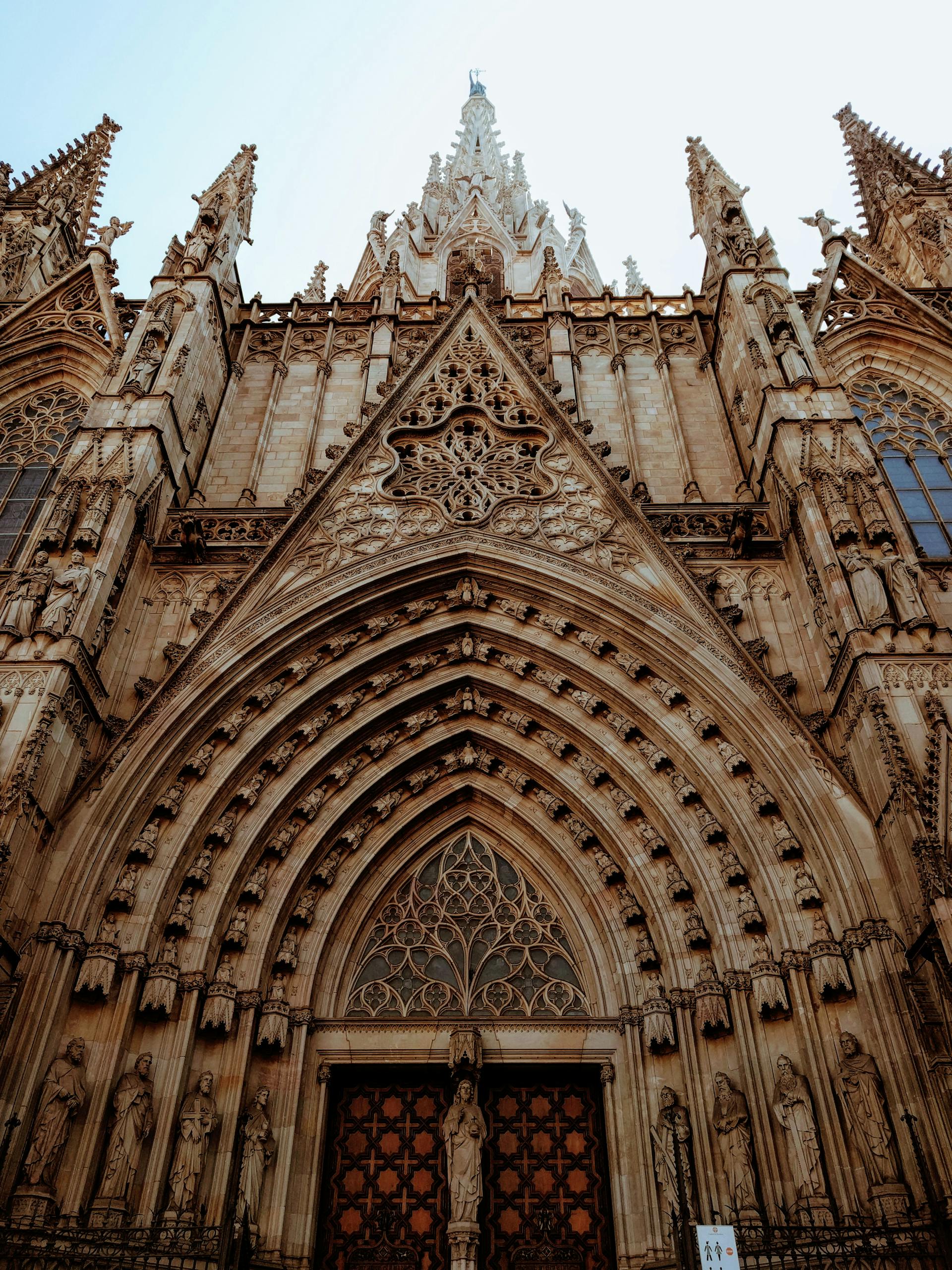 Intricate gothic architecture of the Barcelona Cathedral facade, a historic landmark in Spain.